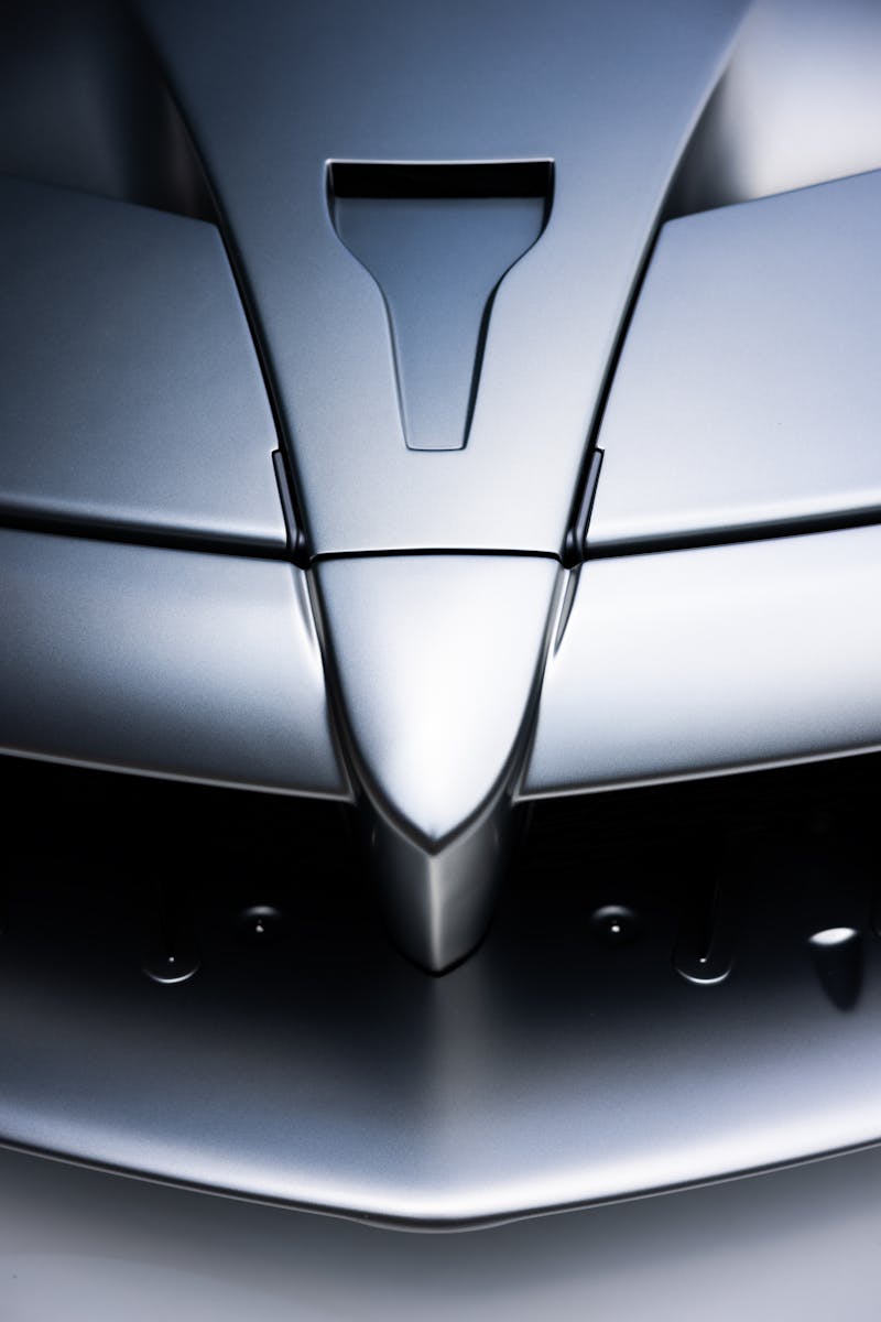 Close-up of a sleek metallic sports car hood. Modern and aerodynamic design.